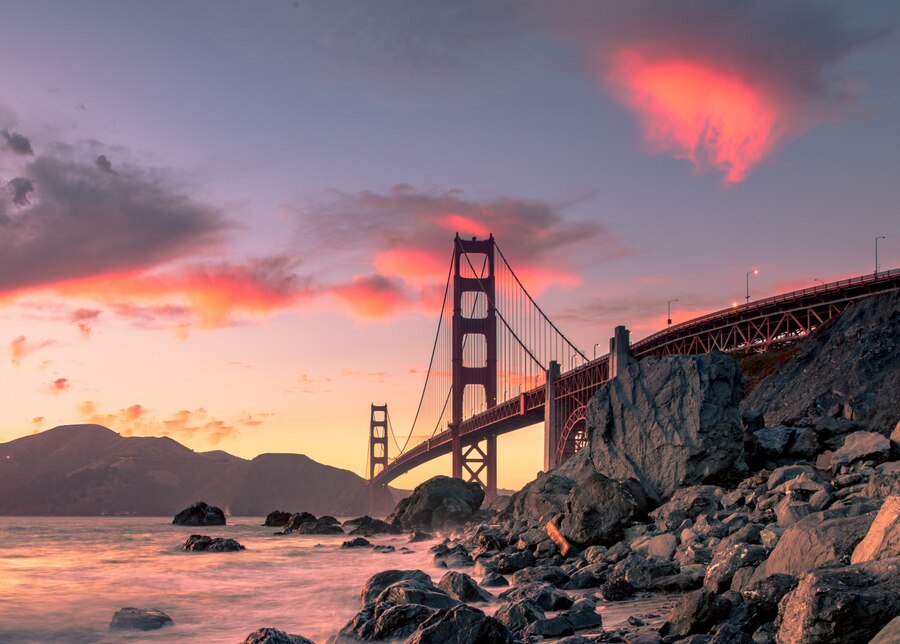 golden-gate-bridge-body-water-near-rock-formations-sunset-san-francisco-california_181624-3228.jpg