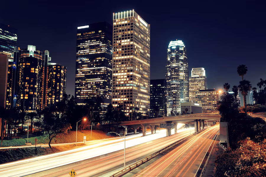 los-angeles-downtown-night-with-urban-buildings-light-trail_649448-2535.avif